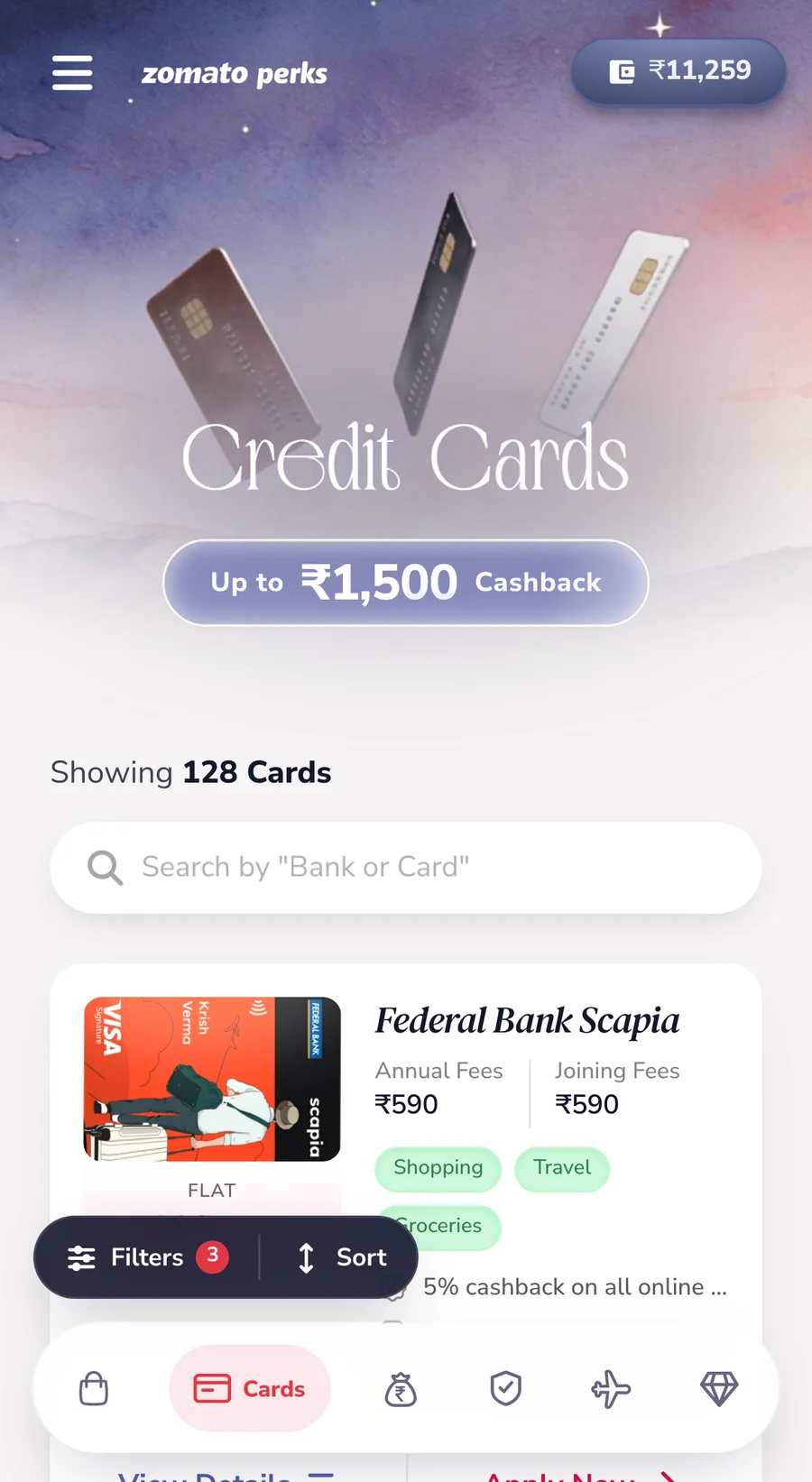 Credit cards on a phone: a watercolour hero and card comparison list